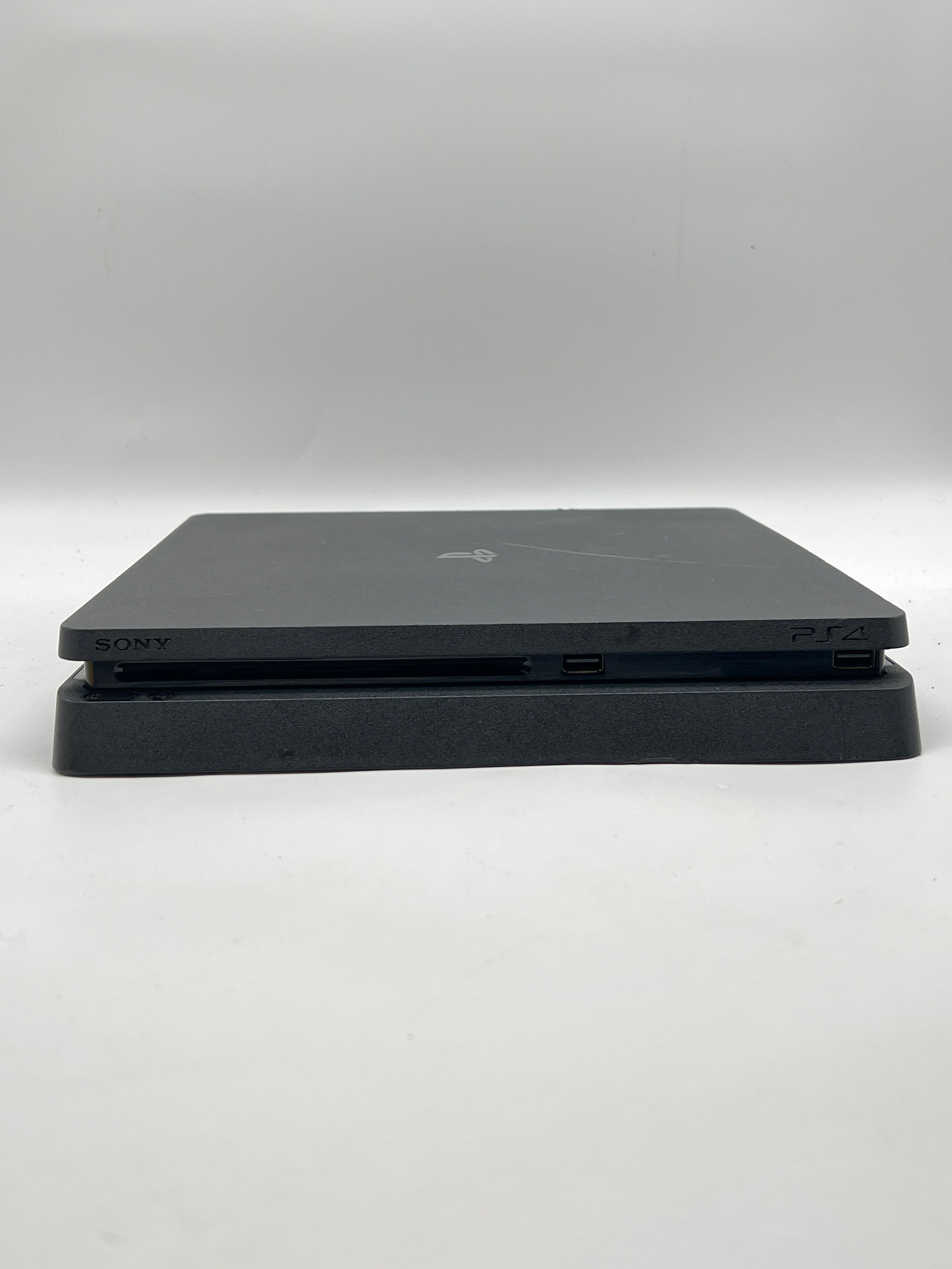 Sony PlayStation 4 Slim 1TB Home Console Black - Used with 2 Controllers