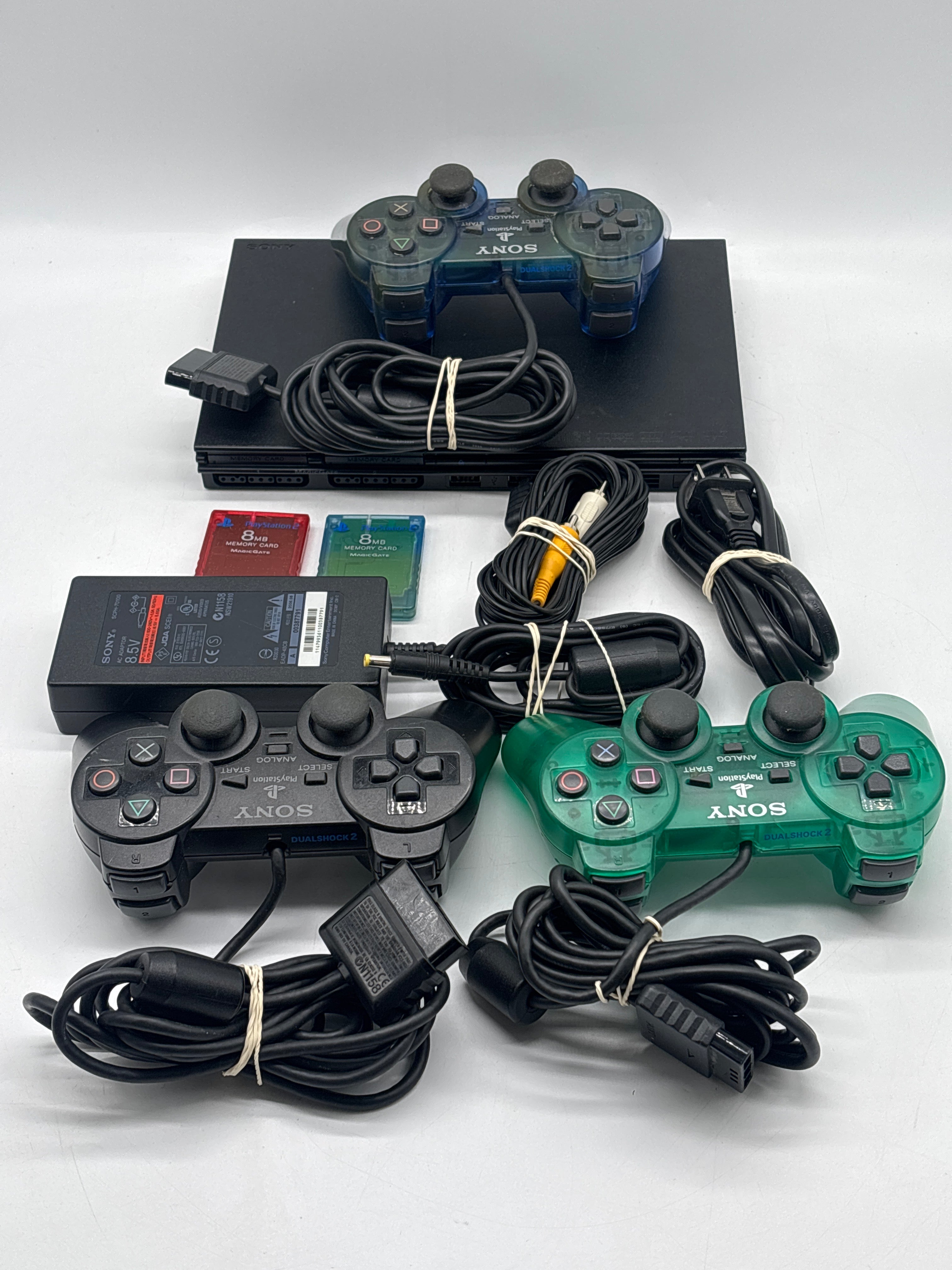 Sony PlayStation 2 Slim (SCPH-77001) + Cables + 2 8GB Storage Cards + 3 Controllers- Used