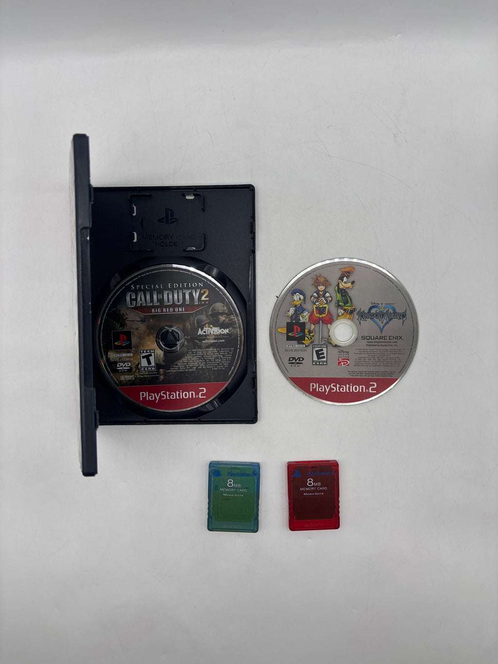 Sony PlayStation 2 Slim (SCPH-77001) + Cables + 2 8GB Storage Cards + 3 Controllers- Used