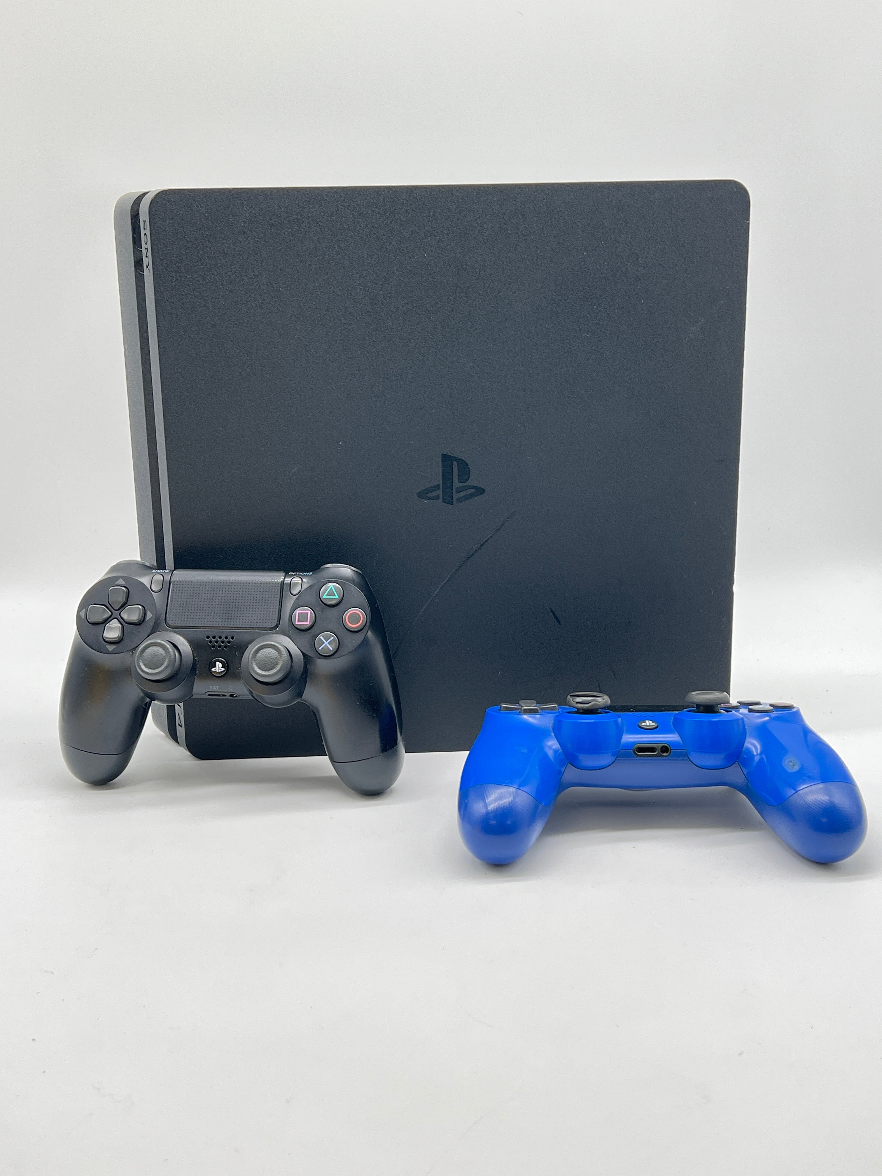 Sony PlayStation 4 Slim 1TB Home Console Black - Used with 2 Controllers