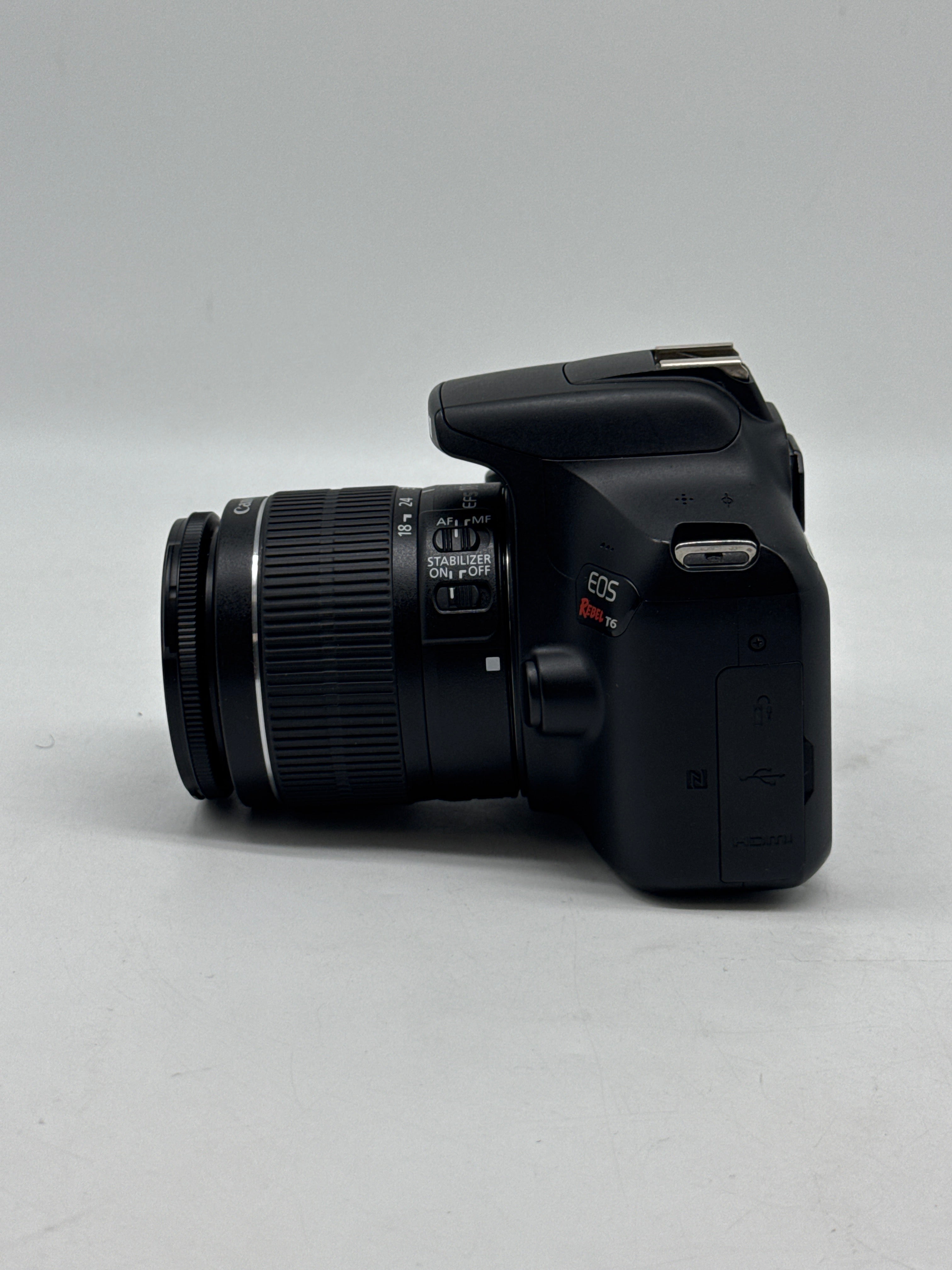 Canon EOS Rebel T6 18.0 MP DSLR Camera W/ Canon Len EF-S 18-55mm f/3.5-5.6 IS II and 2 Charging docks.
