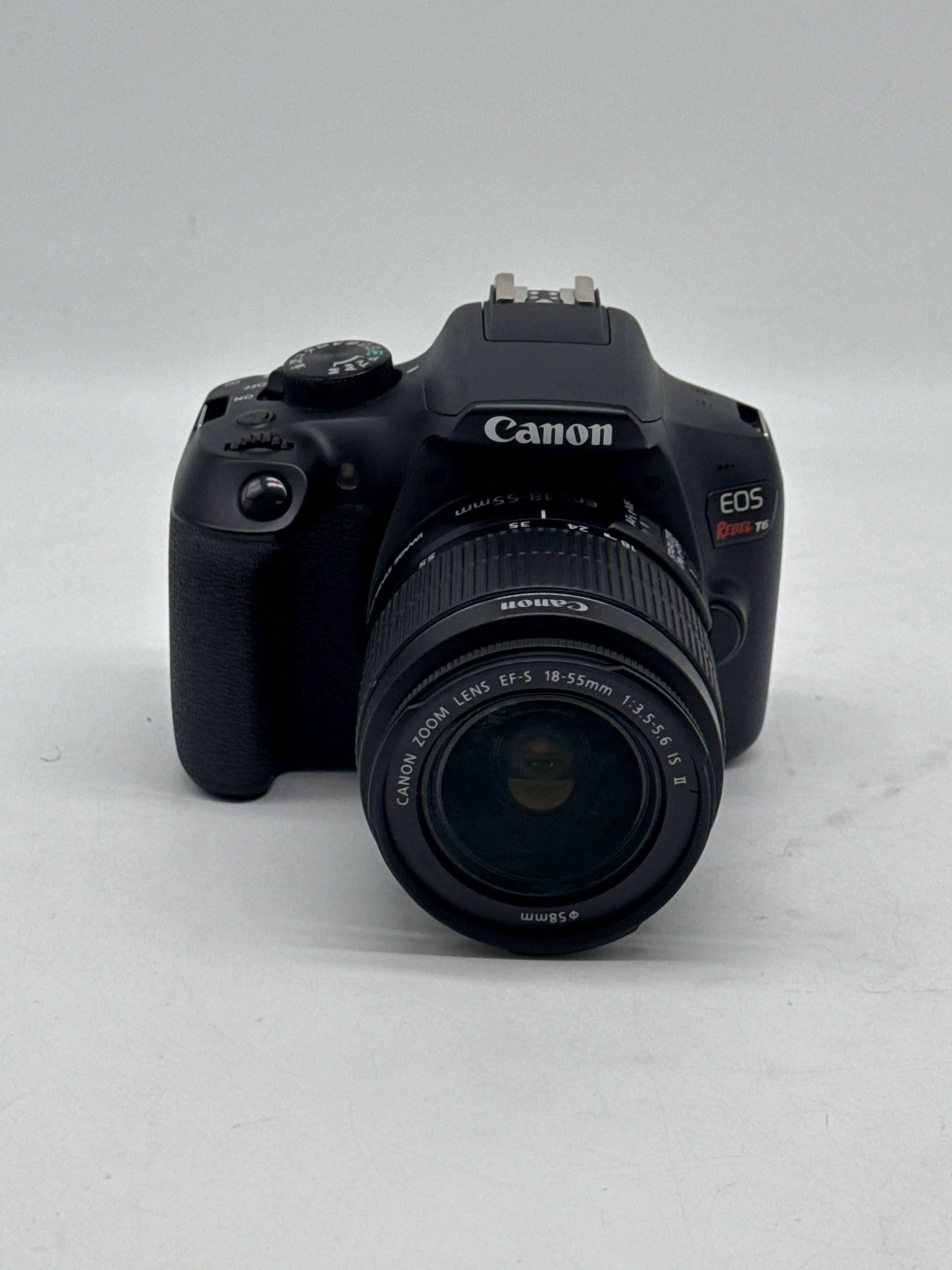 Canon EOS Rebel T6 18.0 MP DSLR Camera W/ Canon Len EF-S 18-55mm f/3.5-5.6 IS II and 2 Charging docks.