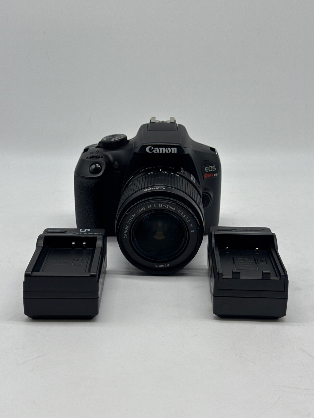 Canon EOS Rebel T6 18.0 MP DSLR Camera W/ Canon Len EF-S 18-55mm f/3.5-5.6 IS II and 2 Charging docks.