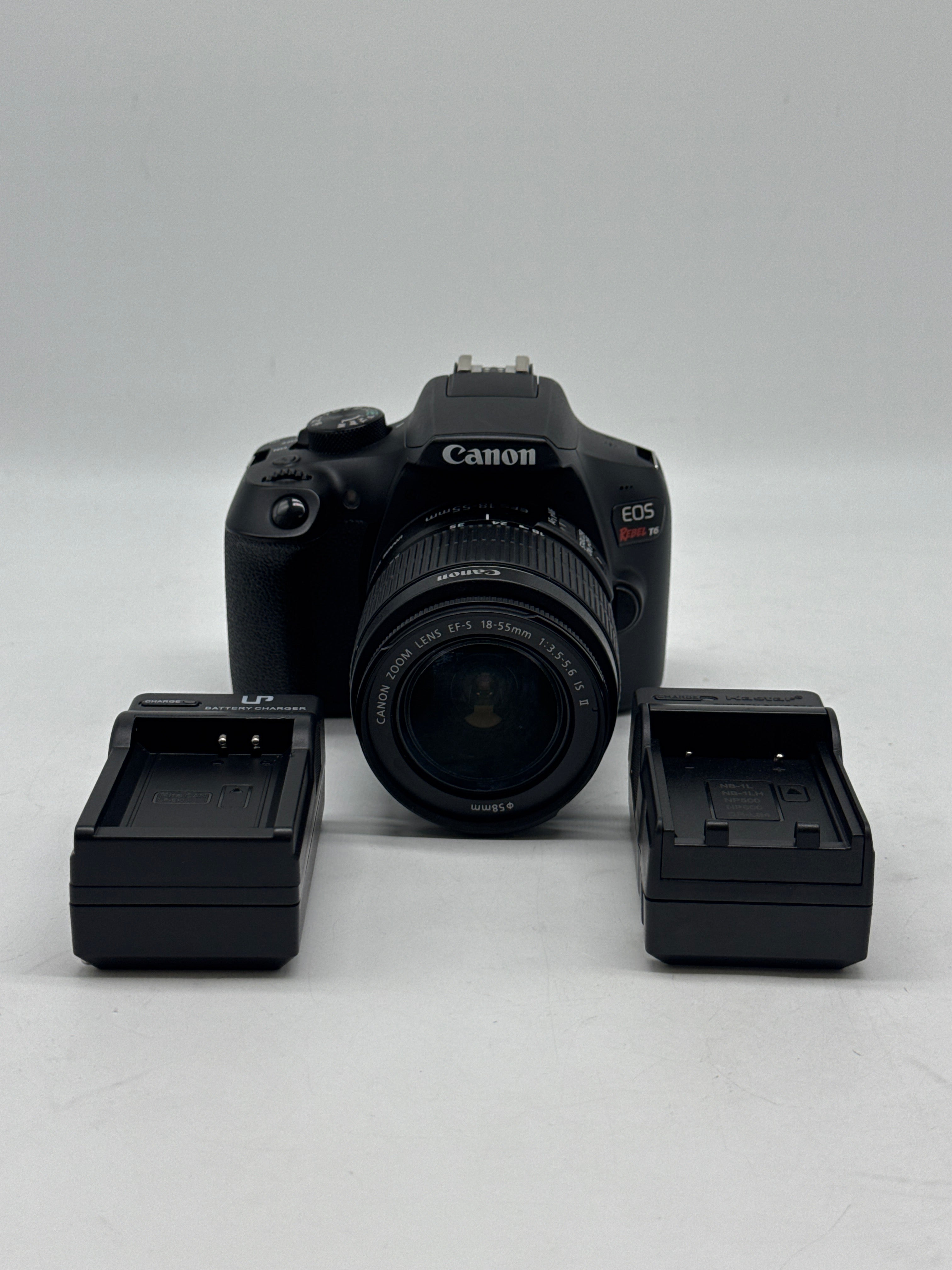 Canon EOS Rebel T6 18.0 MP DSLR Camera W/ Canon Len EF-S 18-55mm f/3.5-5.6 IS II and 2 Charging docks.