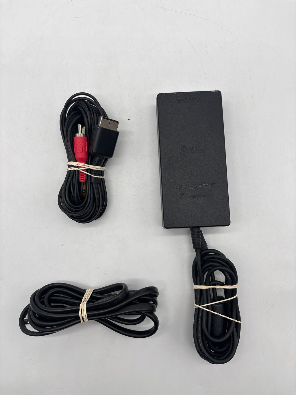 Sony PlayStation 2 Slim (SCPH-77001) + Cables + 2 8GB Storage Cards + 3 Controllers- Used